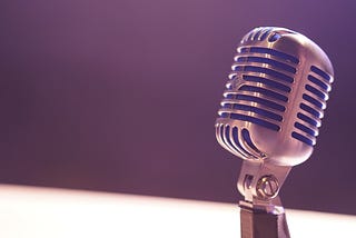 A microphone against a dark background