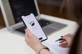 Woman looking at an app on a smartphone