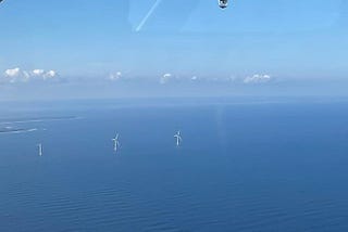 An aerial view of offshore wind turbines