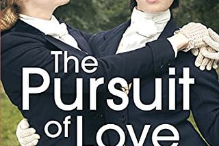 two wealthy young women dressed in blackblazers and white blouses, embracing affectionately. These women are cousins Fanny and Linda, and the image is likely from an on-screen serialisation, based on the novel, The Pursuit of Love.
