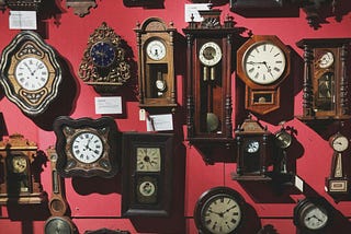 Collection of retro wall clocks in antique store