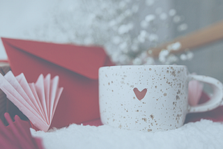 cup and red letter with hearts