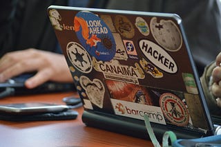 Laptop with a bunch of stickers