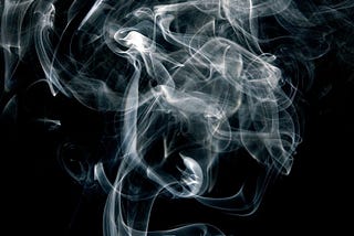 Smoke billowing in the dark.
