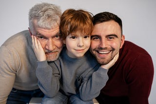 a child with his father and grandfather