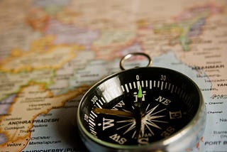 Image of a compass on a map