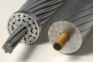 IMAGE: A traditional high voltage wire, with a steel core surrounded by strands of aluminum, versus a modern one, with a carbon fiber core surrounded by trapezoidal pieces of aluminum