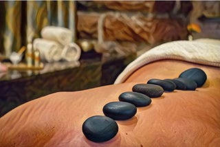 Chaotic Reflections From Woman on the Edge of a Hot Stone Massage Table