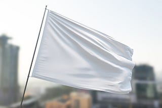 A white, surrender flag waving in the wind