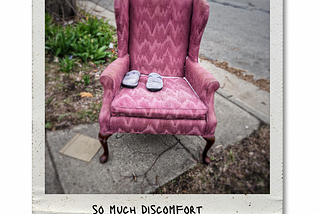 A soft chair and slippers abandoned on the side of the road