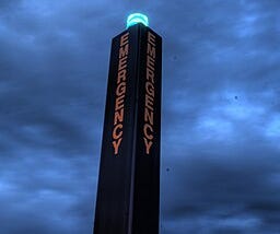 Campus security pole with blue light bulb on top