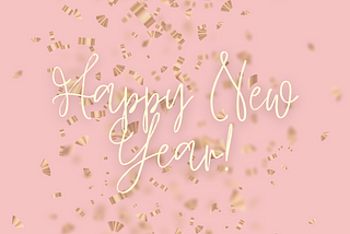 Gold confetti on a pink background with white script reading Happy New Year!