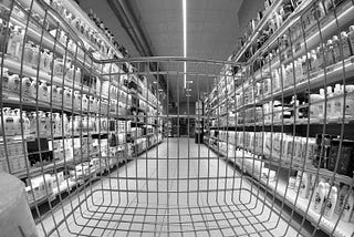 A supermarket aisle seen from the inside of a trolley