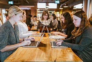 Female employees using an e-learning system for professional training