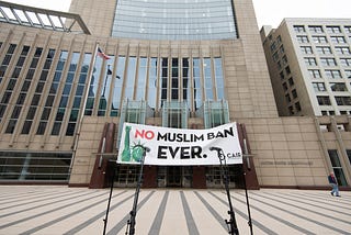 Preparation for protest against the Trump Muslim travel ban, Minneapolis, MN — c.2018. Wikimedia Commons