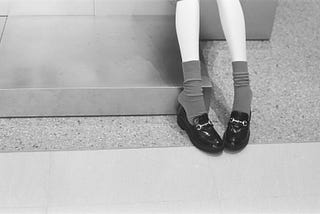 Awkward pose person sitting on step