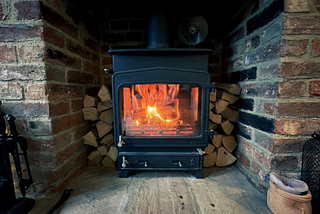 A wood furnace in a room