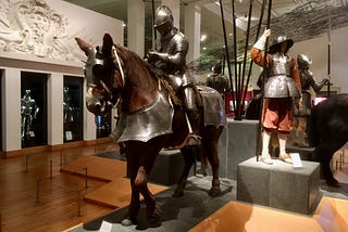 Statues in suits of armour, some on horse statues