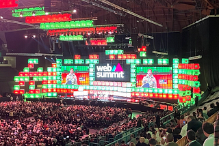 Photo of the Web Summit main stage with a full audience in attendance.