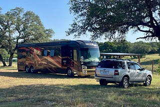 My photo of our motorhome and car parked at the Rebecca Creek RV Park.