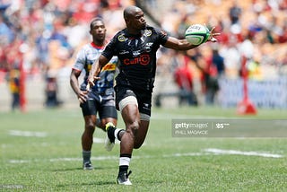 Sharks wing, Makazole Mapimpi grabbing the rugby ball to score another try.