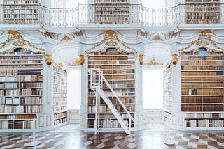 “White wooden bookcase” Photo by Valdemaras D. on Unsplash