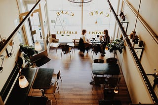 Two women in an empty coffee shop