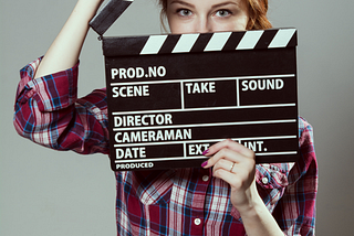 A woman holding a slate, film production, acting career