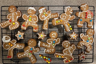 Ninja-styled cookies with writing themes cooling on a rack.