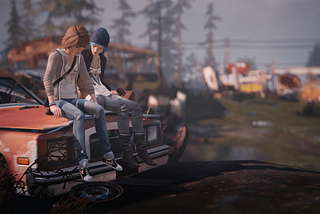A screenshot from Life Is Strange. Chloe and Max, two teenage girls, sit pensively on the trunk of a car in a junkyard.