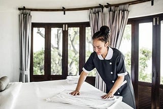 Housekeeping attending to a room