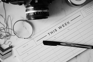Weekly planner with pen