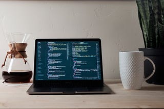 Coffee and computer with code