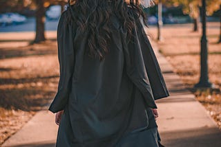 https://www.pexels.com/photo/woman-in-black-long-sleeve-dress-standing-on-brown-concrete-pathway-3186386/