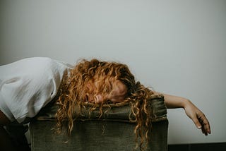 A young woman falls asleep with fatigue.