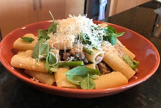 Rigatoni with sausage, spring vegetables and mustard