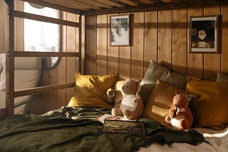 Image of children’s toys on a bottom bunk bed