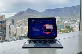 Picture of an iPad with a background of Cape Town table mountains