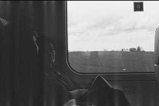black-and-white picture of two women on a train.