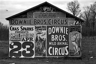 Photo of a barn with circus posters and advertisements, 1936.