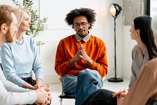 Group Attending a Meeting in a Bright Room