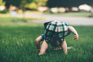 A kid bent over.