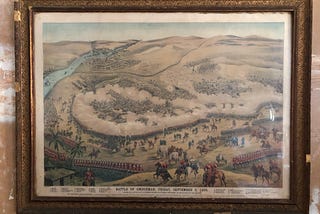 Antique picture of a battle in the desert in a gilt frame