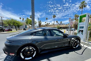 A nice grey car charges at an EV charging station in Palm Springs California