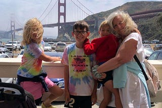 Author and her three grandchildren standing in front of the Golden Gate Bridge in Sausalito, California.