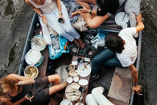 A photo of people enjoying summertime on a boat in Amsterdam