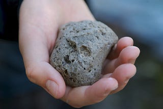 hand holding a pumice stone