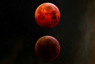 Beautiful image of 3 red moons in the night sky.