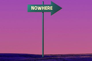 A green sign with the word ‘Nowhere’ is silhouetted against a purple sky.