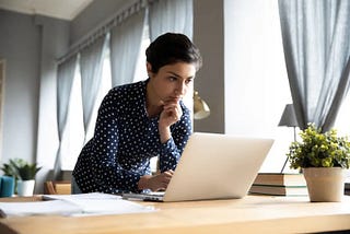 Mom at laptop searching private schools information